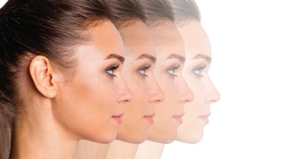 Four side portraits of a woman fading into the white background, perhaps showing progress or transformation.